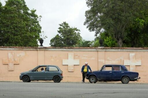 Drivers wait in line to refuel at a gas station in Havana