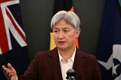 Australia's Foreign Minister Penny Wong addresses journalists during a press conference in Beijing