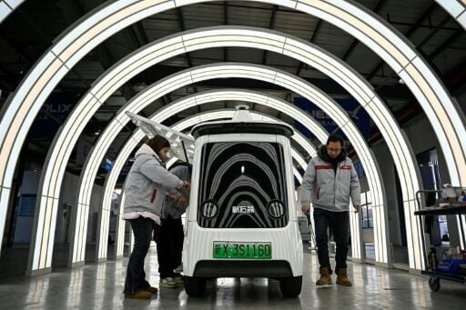 At the Neolix factory, 300 kilometres (186 miles) north of Shanghai, newly built driverless vehicles zoomed around a testing track simulating obstacles including puddles and bridges