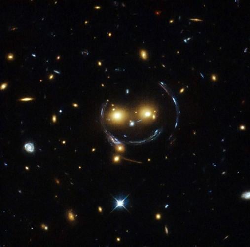NASA shares incredible image of a “smiling” galaxy cluster