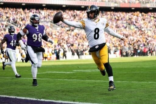 Aaron Rodgers scores a touchdown in Pittsburgh's contentious victory over Baltimore