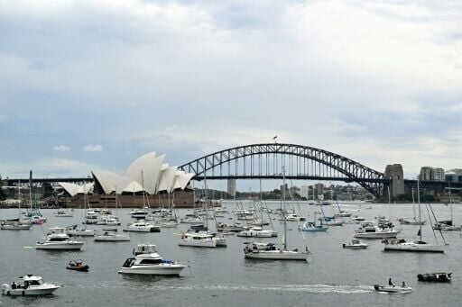 Residents secure spots for their boats near the Sydney Opera House ahead of the New Year's Eve fireworks display