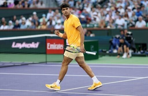 World number one Carlos Alcaraz of Spain celebrates on the way to a second-round victory over Bulgarian Grigor Dimitrov at Indian Wells