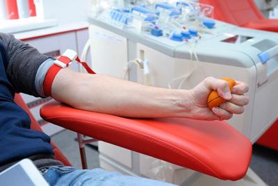 Preparing for taking blood from vain. Arm pressing ball for better blood pressure