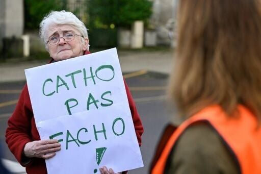About a hundred people gathered outside the church to protest the ceremony
