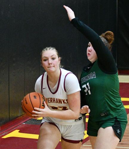 Evelyn Rogers (23) passes the ball out of the paint against Estacada earlier this year.