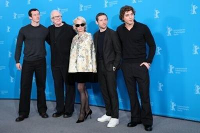 Pamela Anderson and team pose during a photo call for 'Rosebush Pruning' at the Berlin Film Festival