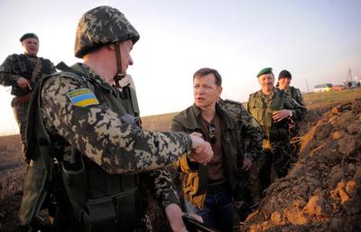 Ukraine defense chief resigns; troops leave Crimea