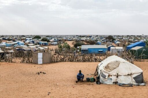 A refugee sits outside his tent at the Mbera refugee camp in Mauritania's Hodh Chargui region on April 27, 2026