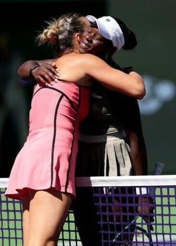 Aryna Sabalenka and Victoria Mboko share a hug after Sabalenka's victory in their Indian Wells quarter-final