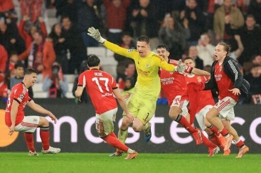 Benfica goalkeeper Anatoliy Trubin (C) scored a last-gasp goal to keep Jose Mourinho's men in the Champions League