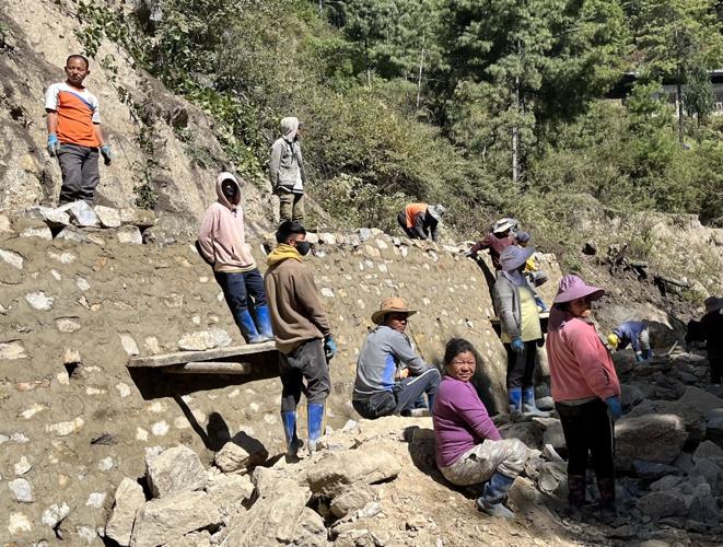 Indian nationals working on road repairs.