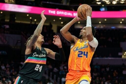 Charlotte's Brandon Miller shoots over San Antonio's Devin Vassell on his way to a game-high 26 points in the Hornets' win over the Spurs