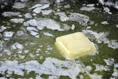 Margarine melts more consistently than butter due to its chemical makeup.