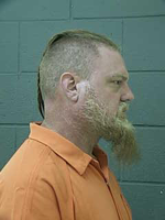 TD man arrested on bomb charges