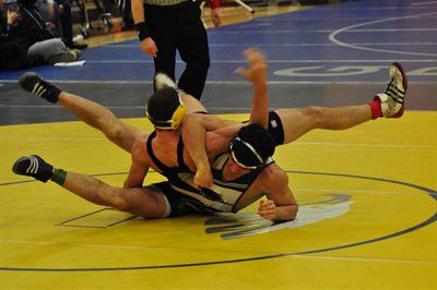Mallon, Castro win titles as Eagle wrestlers send ten to state