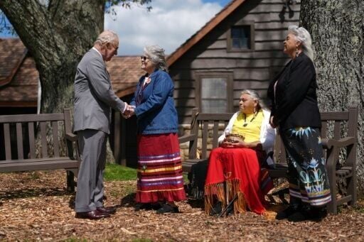 Britain's King Charles III speaks with members of the Monacan Indian Nation during a visit to Shenandoah National Park, in the US state of Virginia