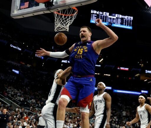 Denver's Nikola Jokic reacts after a dunk in the Nuggets' NBA victory over the San Antonio Spurs
