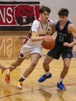 Bruin boys split two playoff games