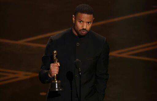 Michael B. Jordan accepts the award for Best Actor in a Leading Role for "Sinners"
