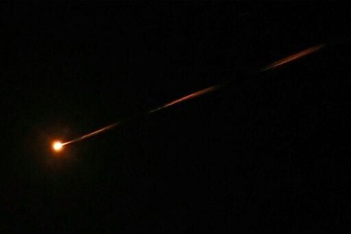 A missile streaks accross the sky over Jerusalem amid a fresh barrage of Iranian missiles on March 30, 2026
