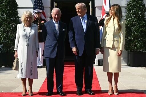 US President Donald Trump (C/R) and First Lady Melania Trump (R) greet Britain's King Charles III (C/L) and Britain's Queen Camilla upon arrival at the South Portico of the White House
