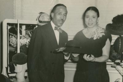 Mae Reeves and her husband, Joel, pose with her hats at Mae's Millinery in Philadelphia, circa 1953.
 Collection of the Smithsonian National Museum of African American History and Culture/Gift from Mae Reeves and her children Donna Limerick and William ...