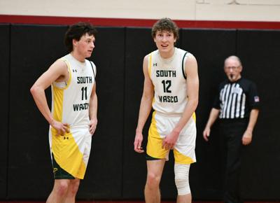 George Barnett (11) and Jason Hull (12) chat during the Big Sky championship on Feb. 21.