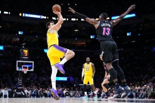 Los Angeles Lakers star Luka Doncic takes a shot over Bam Adebayo in the Lakers' NBA victory over the Miami Heat