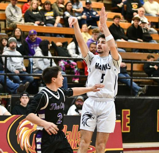 Calder Morrison (5) puts up a three against Baker earlier this year.