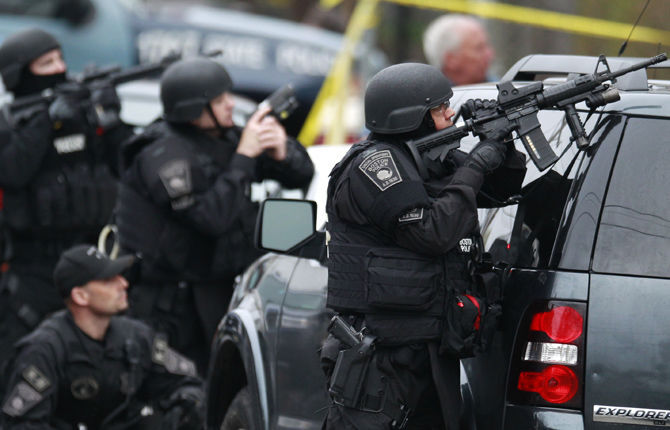 Bombing suspects kill MIT officer, forces converge on their location