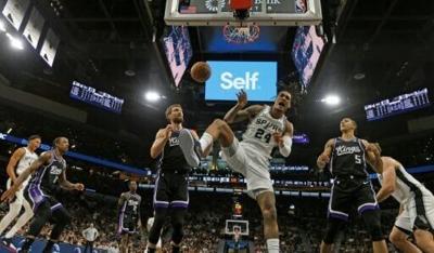 Devin Vassell of the San Antonio Spurs celebrates after a dunk in an NBA victory over Sacramento