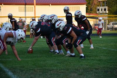 Columbia lineman get ready at the line of scrimmage in a game earlier this year