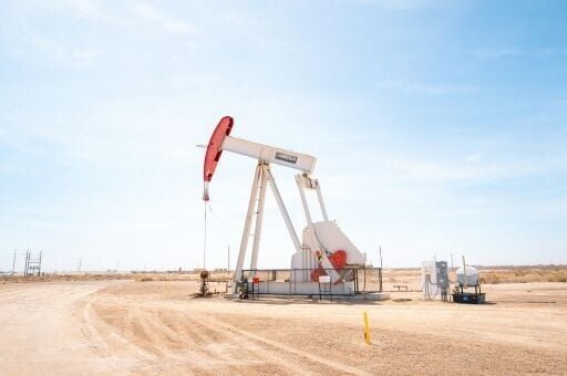 The benchmark international oil contract fell back under $100 per barrel but later cut its losses