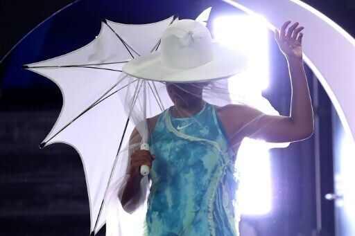 Japan's Naomi Osaka walks onto the court to face Croatia’s Antonia Ruzic