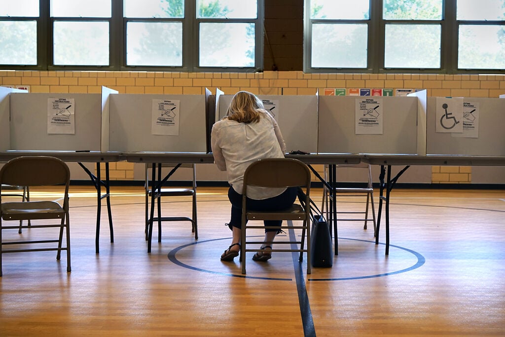 Kathy Trabue fills out the voting sheet