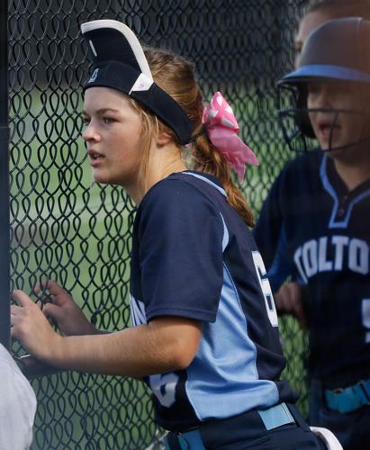 Sporting her rally cap, Paige Bedsworth watches a teammate at the