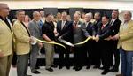 Missouri Orthopaedic Institute patient Matt Boehner cuts the opening ribbon