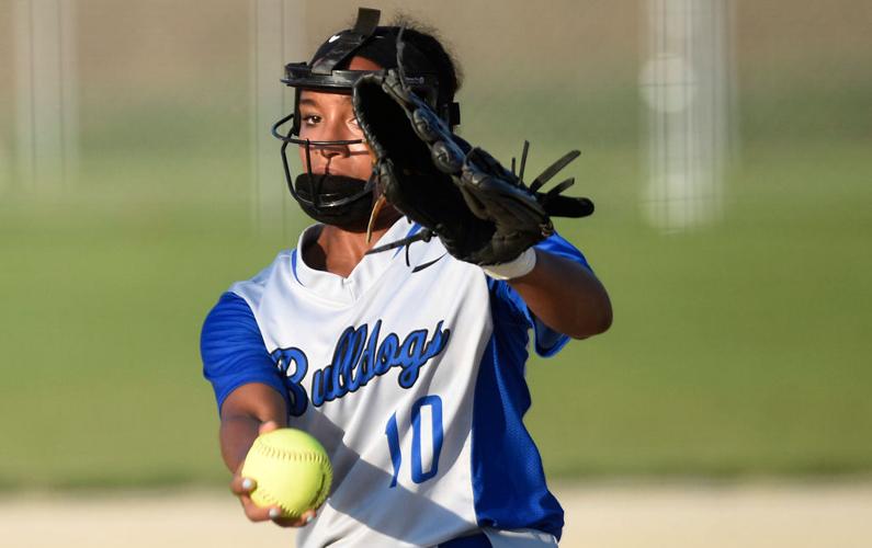 Sporting her rally cap, Paige Bedsworth watches a teammate at the