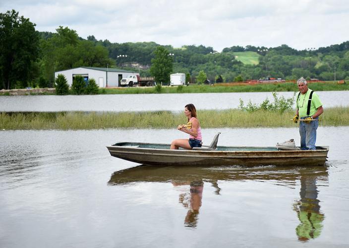 Kim Baumgartner and Jim Epple row down the flooded plain