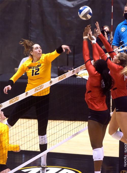 Missouri's Kylie Deberg spikes the ball