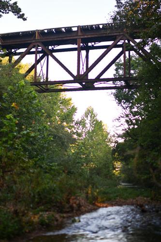 Haw Creek flows under an abandoned railroad bridge