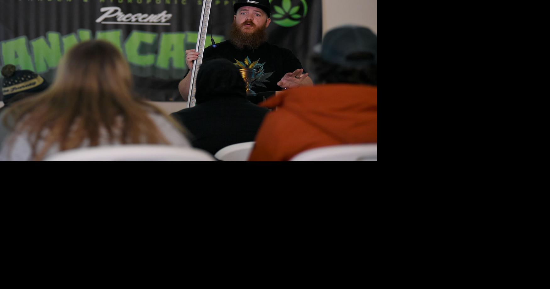 Grow Buddies owner Jonathan Barfield holds a grow light News