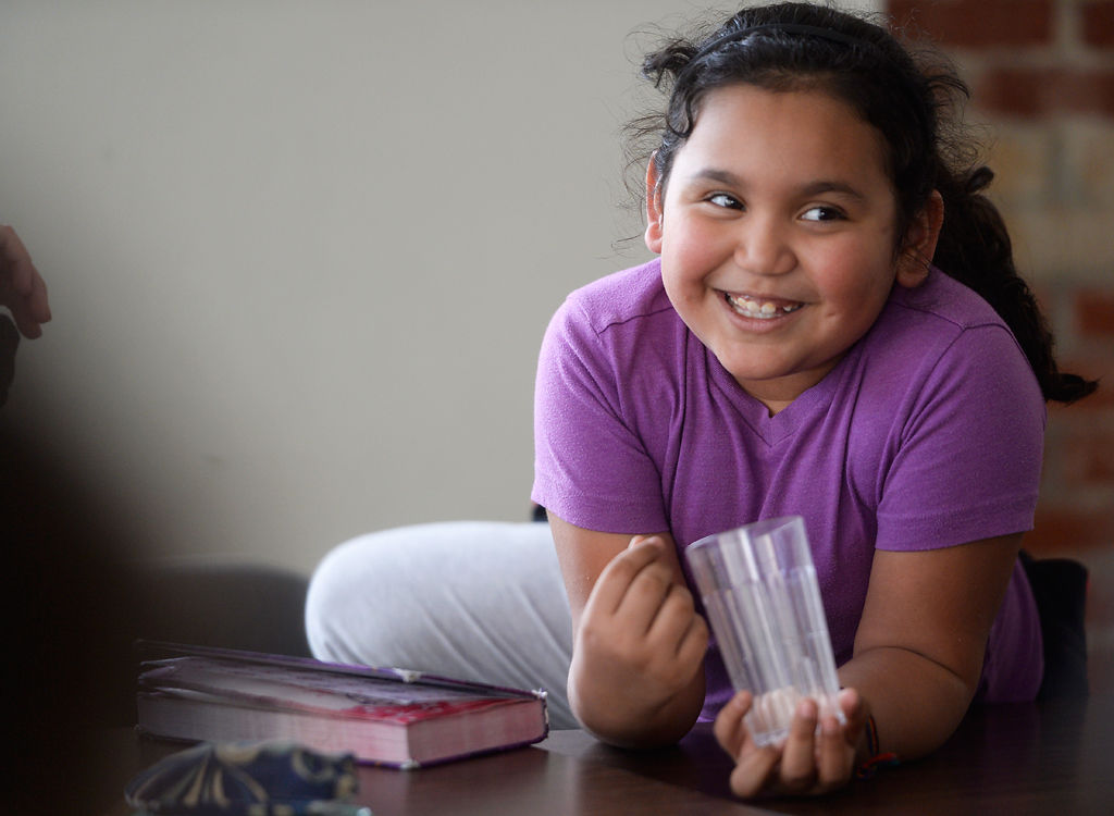 Anna Ortiz waits for her partner to read with her