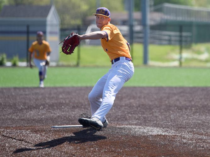 Tait Robertson winds up to pitch the ball