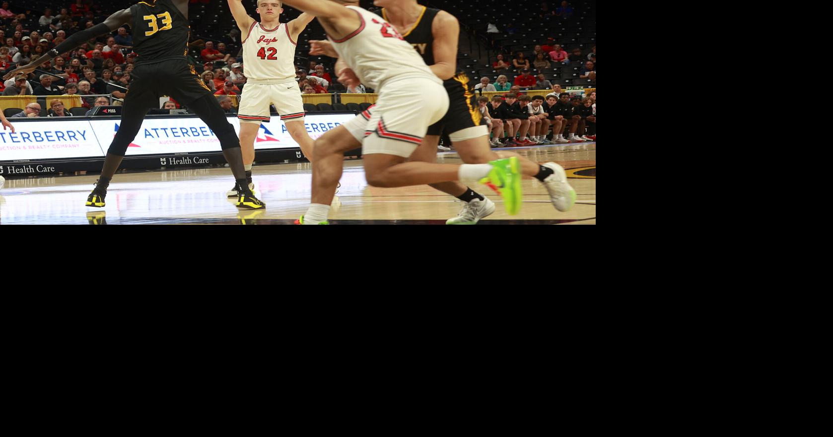 Jefferson City forward Nelson Shinkle looks to pass the ball