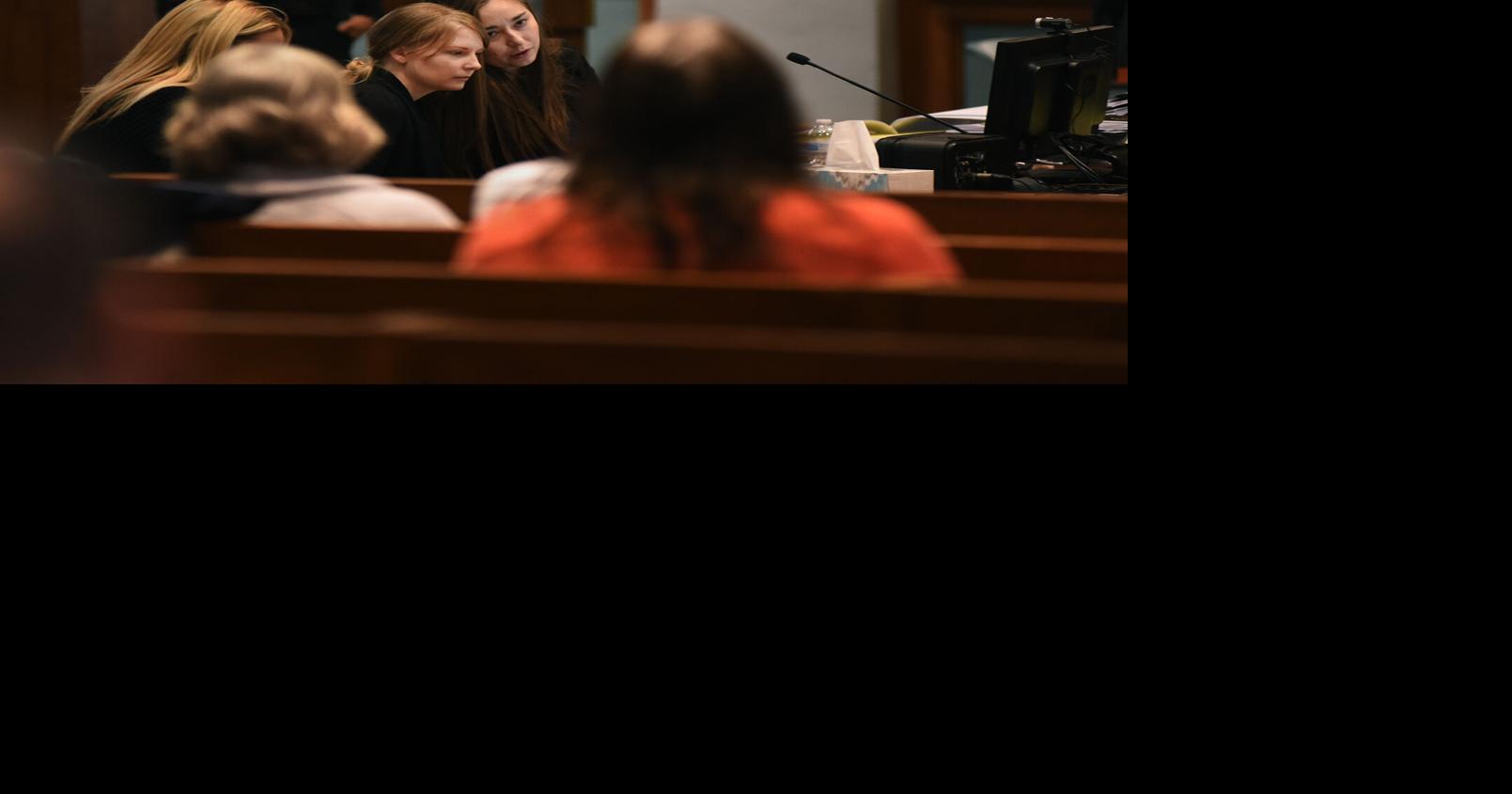 Lynlee Renick, center, listens to defense attorney Katherine Berger