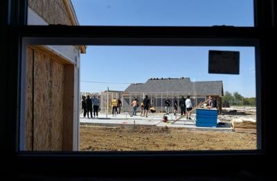Giving back: MU football team builds houses with Habitat for Humanity