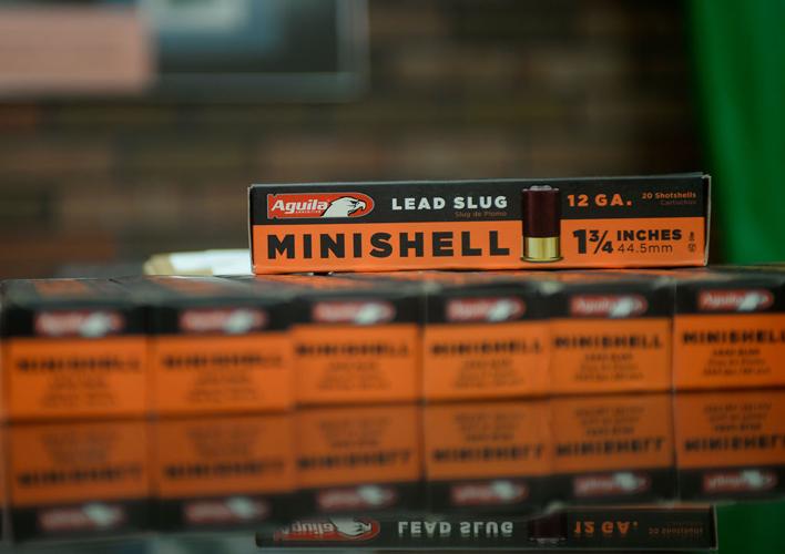 Shotgun shells are displayed on the store counter