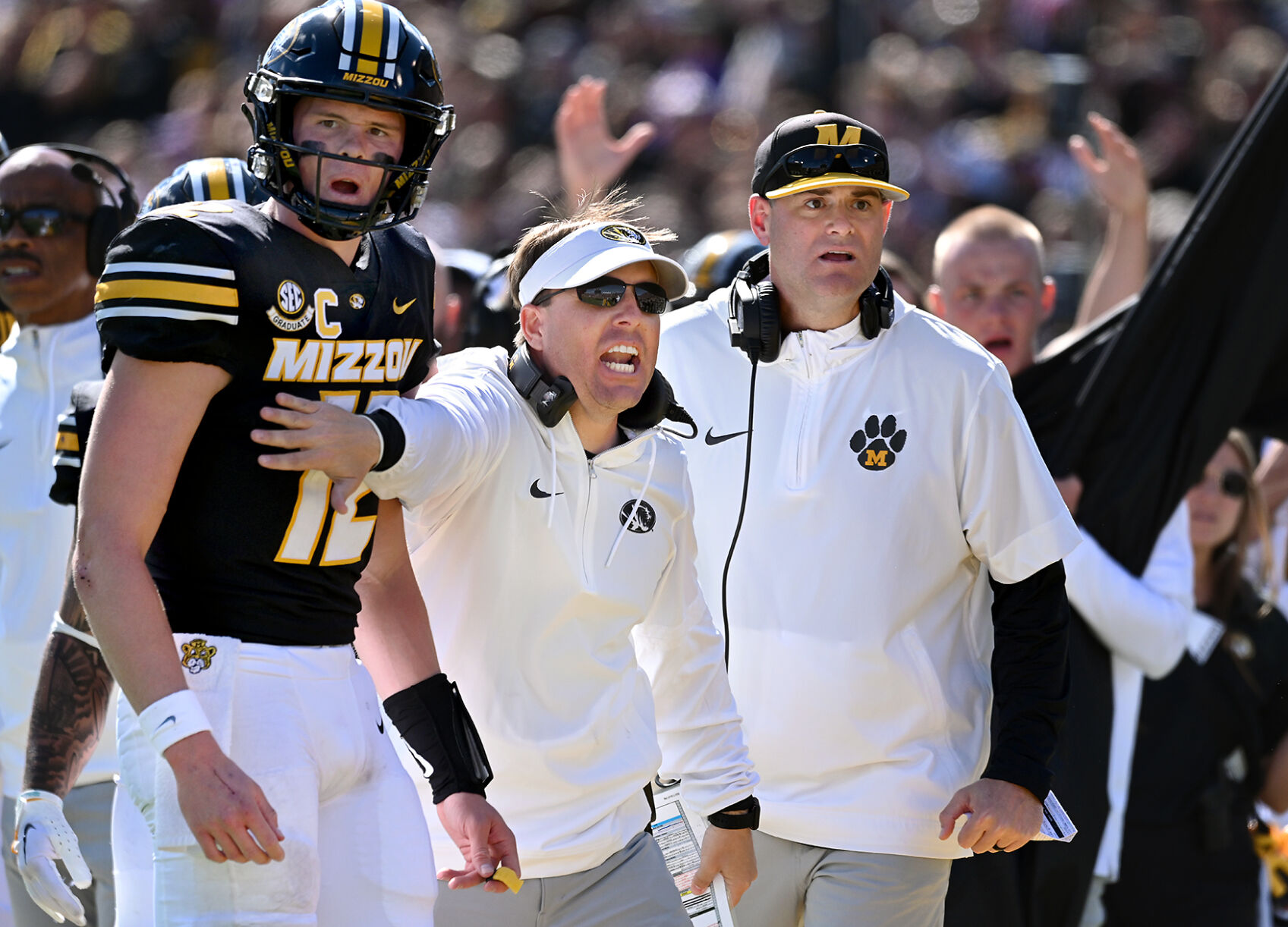 Mizzou Coach Eli Drinkwitz, Center, Holds Quarterback Brady Cook Back ...